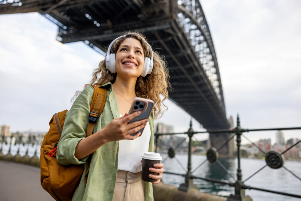 Tourist sightseeing in Sydney under the Harbor Bridge
